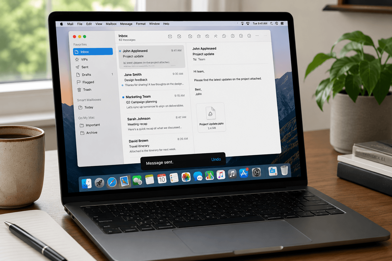 Silver MacBook Pro laptop open on a lap for writing and sending email on the go